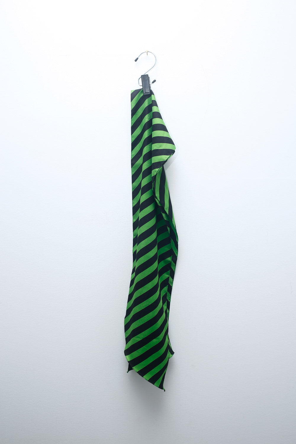 Green and black striped satin scarf with diagonal stripes, lightweight vintage accessory for versatile styling.