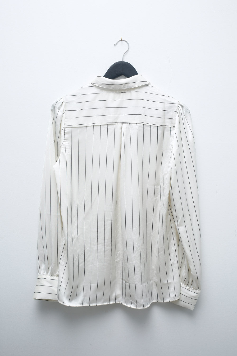 Vintage Hannah Blair white satin blouse with black vertical stripes, button-up front, and long sleeves with cuffed wrists.