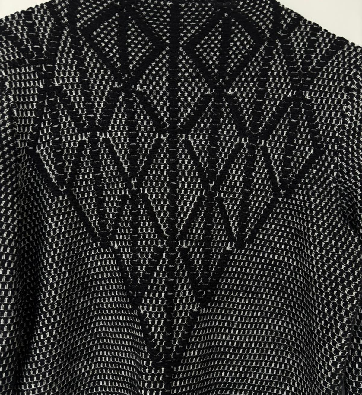 Black and white patterned garment on a hanger